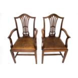 A pair of 19th century mahogany framed open arm carver dining chairs.