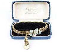 A mid-Victorian gold, turquoise-enamel and diamond scroll and trefoil motif mesh bracelet.