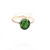 An early 20th century rose gold and small bloodstone signet ring.