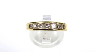 An 18ct gold and diamond half-eternity ring. The seven round brilliants approx. 0.