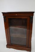 A Victorian rosewood pier cabinet.