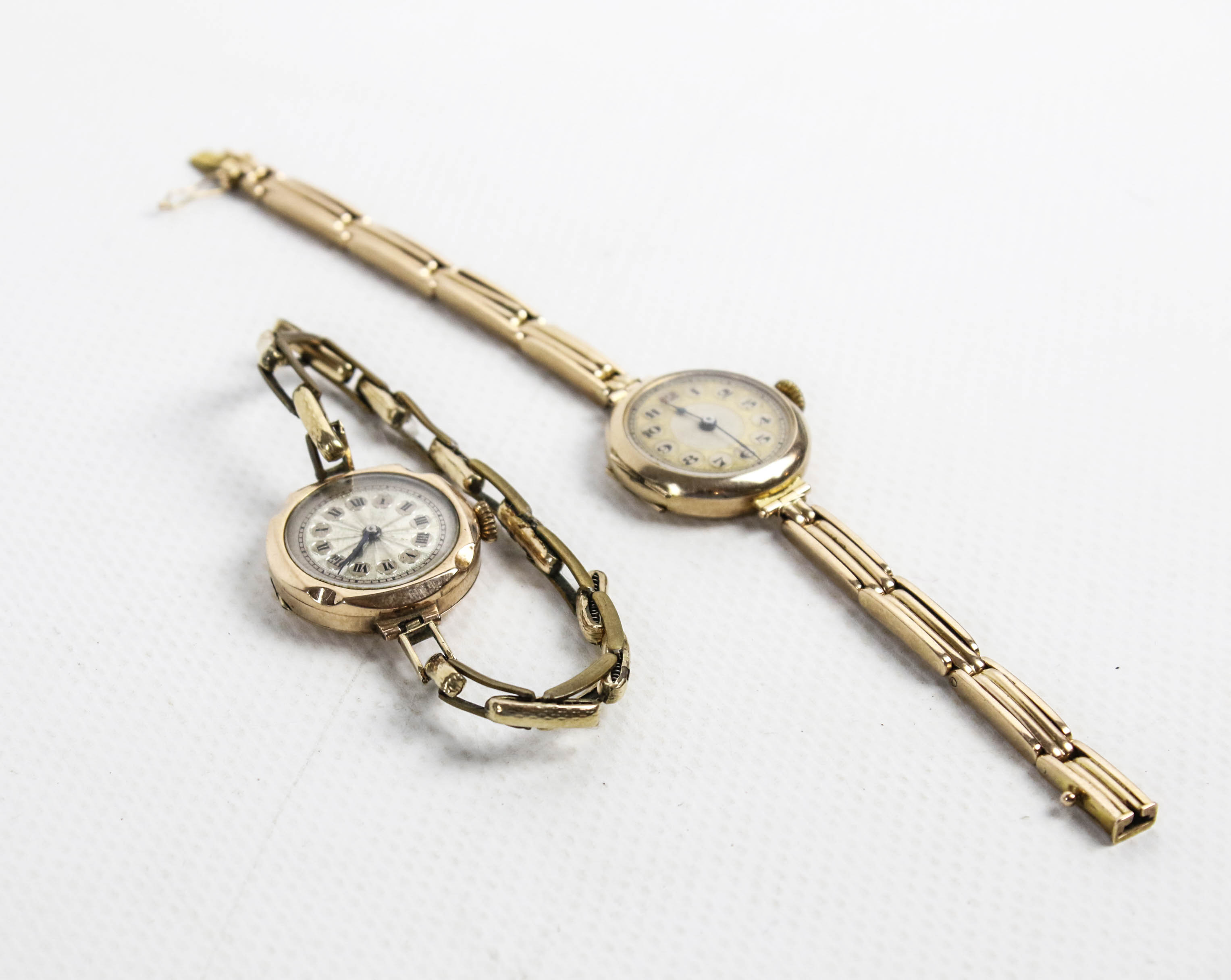 Two early 20th century lady's gold round bracelet watches.