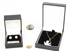 A small collection of 9ct gold jewellery. Including; an oval hematite 'centurian' intaglio ring.