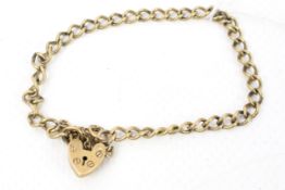 A 9ct gold curb link bracelet on a padlock clasp.