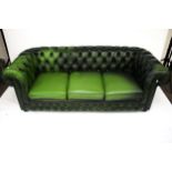 A late 20th century green leather button back Chesterfield settee.