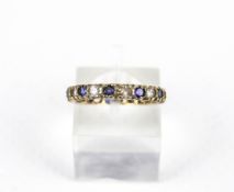 A vintage 9ct gold, blue and white synthetic-sapphire eternity ring. The 2.