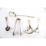 A late Victorian crested silver rat tail sifter spoon, three small spoons and a sugar tong.