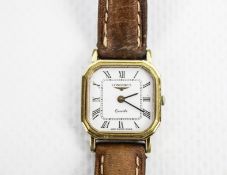 Longines, a lady's gold-plated and stainless steel quartz wristwatch.