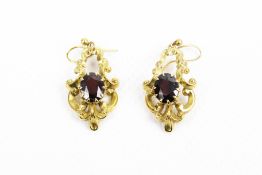 A pair of vintage 9ct gold and oval garnet pendent earrings in early Victorian style.