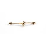 An early 20th century gold, pearl and diamond 'bud' shaped pin brooch. Unmarked, 2.