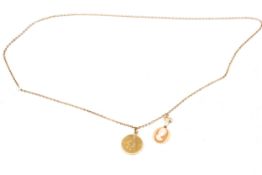 A 9ct gold and small shell cameo pendants and a chain.
