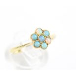 A mid-20th century small opal seven stone flower-head cluster ring.