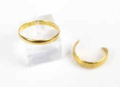 Two 22ct gold wedding bands. Comprising: a D-section wedding band, hallmarks for Birmingham 1933, 2.