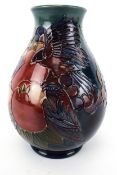 A 20th century Moorcroft 'Pomegranate, Grape and Bird' baluster vase.