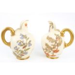 A pair of Royal Worcester jugs.