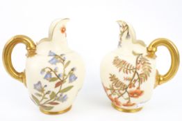 A pair of Royal Worcester jugs.