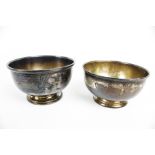 Two similar silver round sugar bowls.