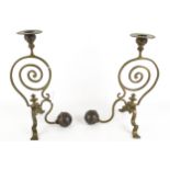 A pair of Arts and Crafts WAS Benson style brass and copper candlesticks.