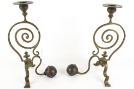 A pair of Arts and Crafts WAS Benson style brass and copper candlesticks.