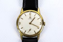 Omega, a gentleman's gold-plated and stainless steel wristwatch, circa 1964.