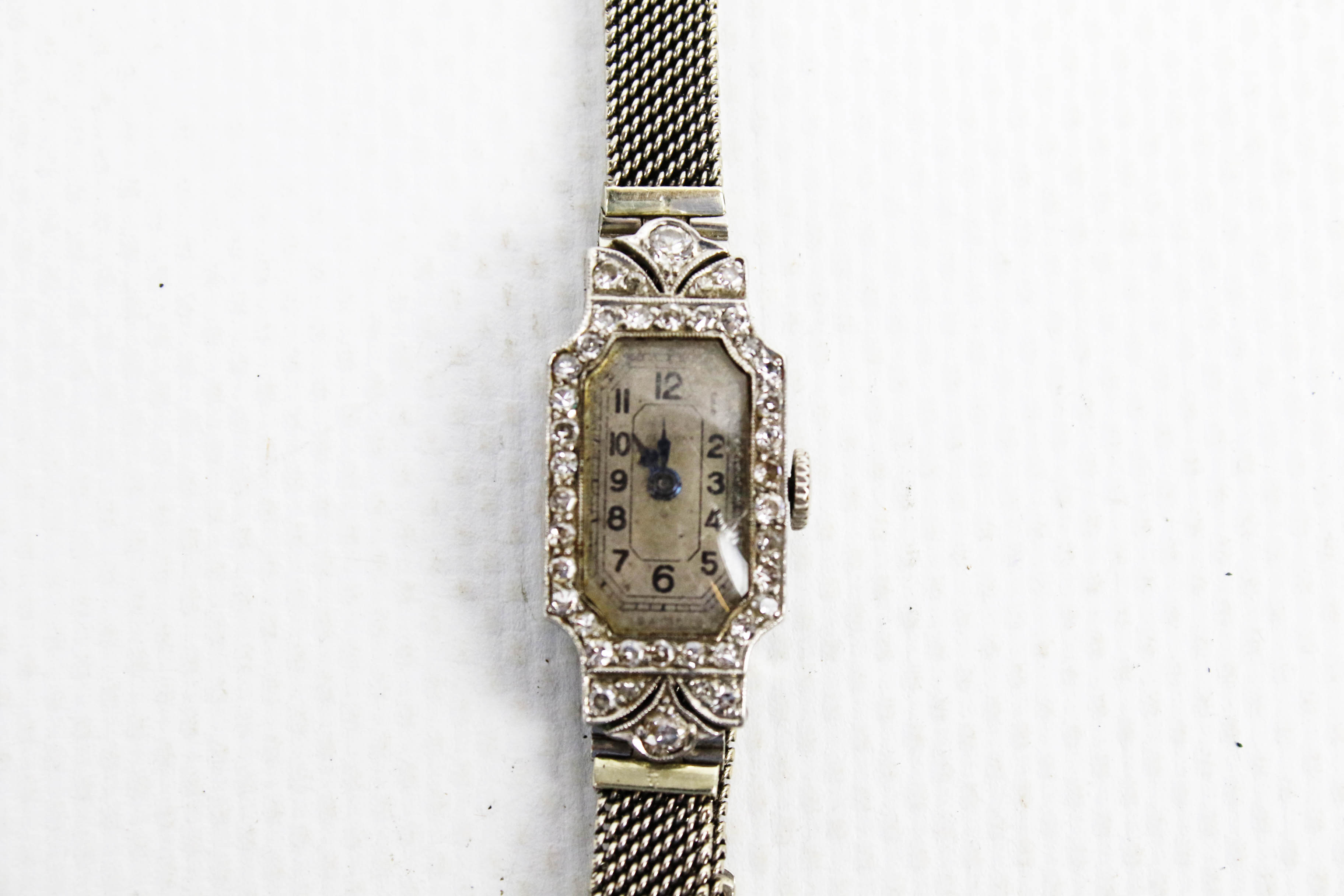 A lady's Art Deco platinum and diamond rectangular bracelet watch.