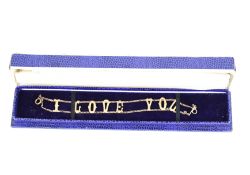 A vintage 9ct gold openwork bracelet 'I Love You'.