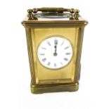 A circa 1900 brass carriage clock.