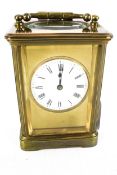 A circa 1900 brass carriage clock.