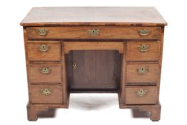 An 18th century walnut knee hole desk.