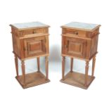 A pair of walnut Louis XVI style French bedside cabinets.