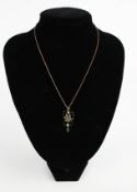 An Edwardian gold, turquoise and half-pearl pendant and chain.