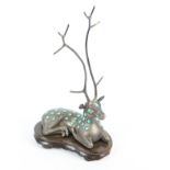 A Scandinavian(?) 'Sterling Silver' and turquoise ring tree in the form of a recumbent deer.