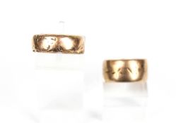 Two 9ct rose gold broad wedding bands.