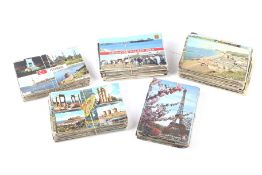 A collection of 20th century coloured postcards.