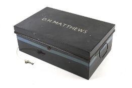 A vintage lockable tin document carrying box. Painted black with 'D. H.