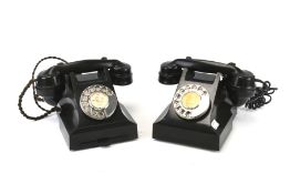 Two vintage GPO black bakelite rotary telephones.