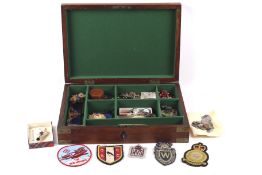 A large wooden box containing an assortment of mixed collectables.