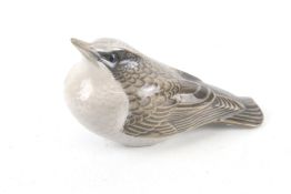 A Royal Copenhagen ceramic bird.