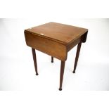 A vintage mahogany drop leaf table.