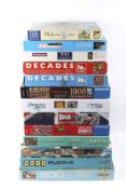 A collection of thirteen assorted boxed jigsaw puzzles.