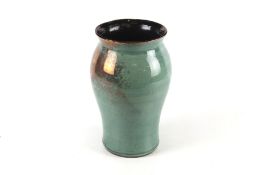A contemporary Blagdon Lustre vase. Glazed in green and blue, with a flared rim, H27.