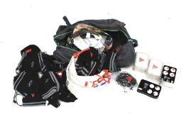 An assortment of golf related items. Including Callaway ball gift set, bags etc.