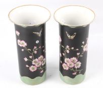 A pair of late 19th century English pottery cylindrical vases.