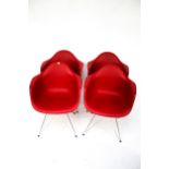 Vintage Retro: A set of four Charles & Ray Eames designed mid century style ' DAR' red armchairs.