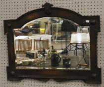 A 19th century style bevelled edge wall mirror.