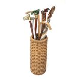 A wicker stick stand and contents.