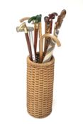 A wicker stick stand and contents.