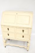 A 19th century oak bureau, painted cream.