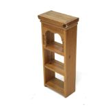 A contemporary pine shelf unit. With three shelves.