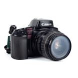 A Canon EOS Elan 35mm SLR camera. With a 28-80mm Ultrasonic lens.